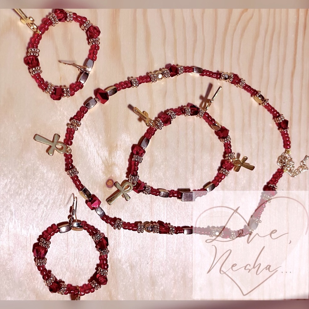 Red with gold accents. Necklace bracelet with earrings.